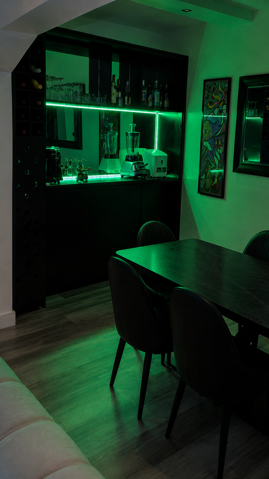 Gold 7 Residence mini bar with wine shelving, glassware and green mood lighting