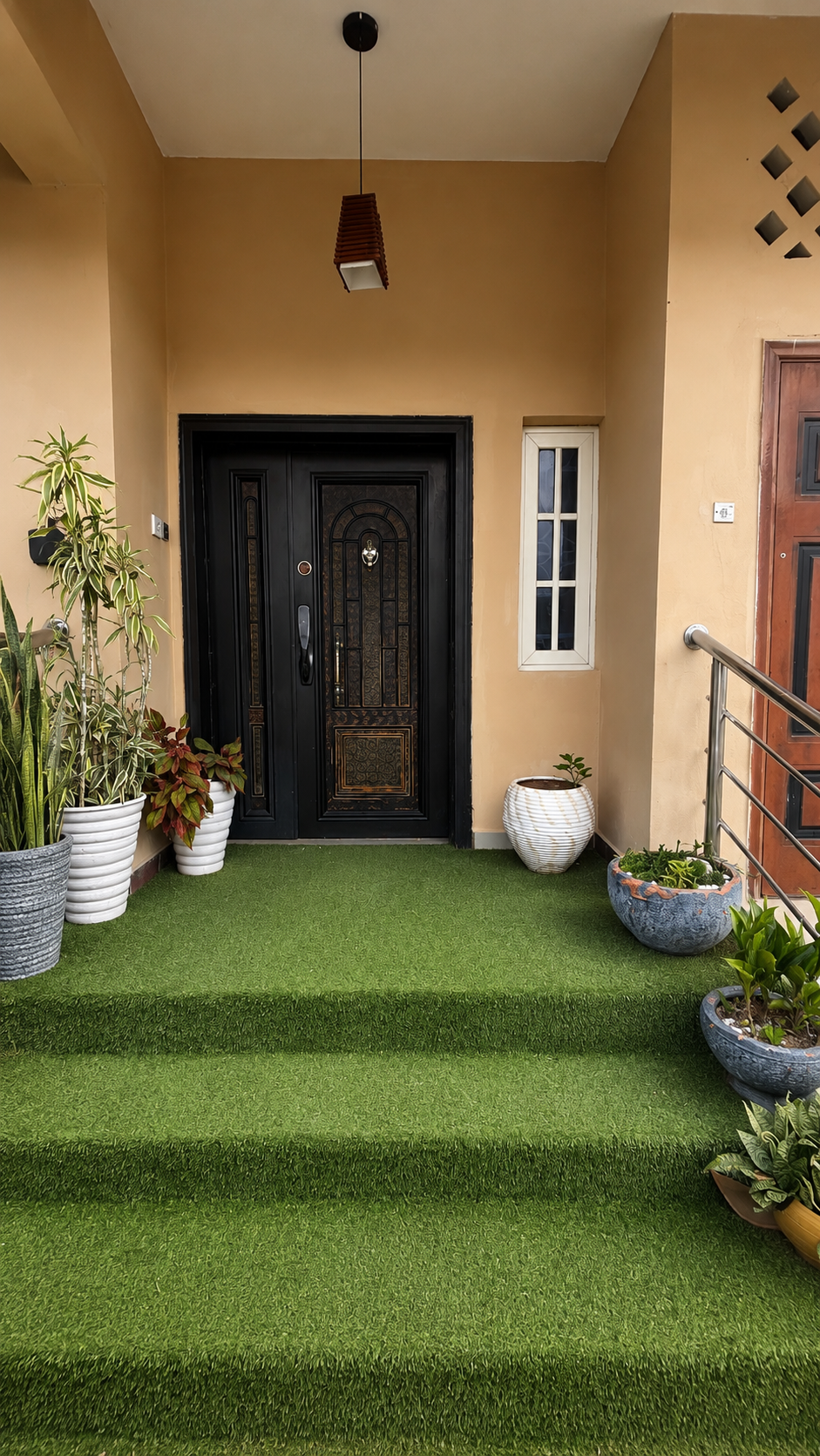Gold 7 Residence private front porch entrance with plants