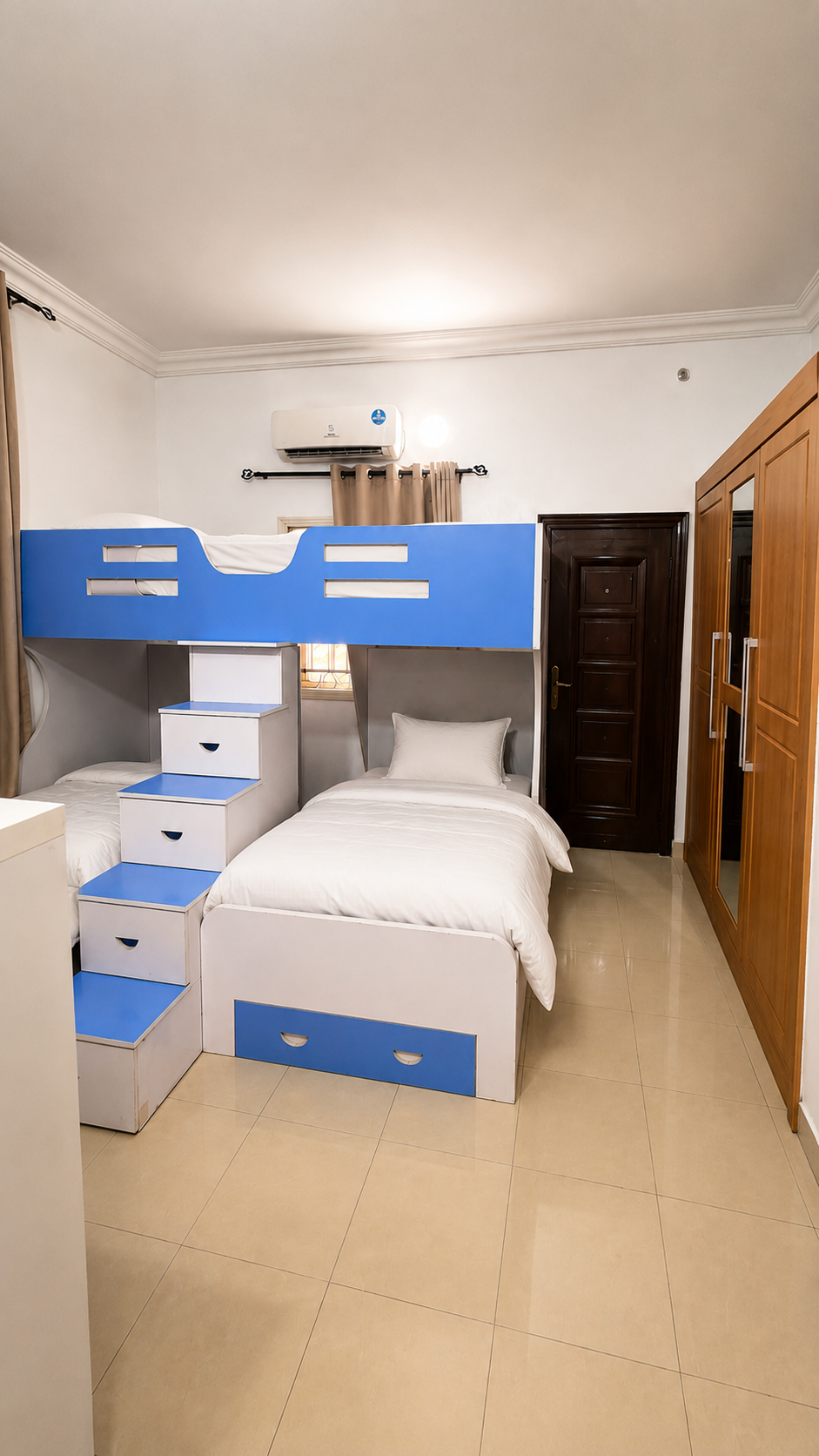 Gold 7 Residence kids bedroom with bunk bed and staircase storage